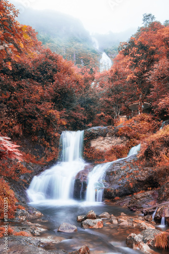 Silver waterfall or Thac Bac on fog in autumn