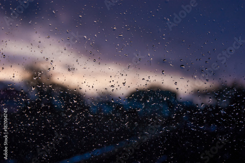 On a wet glass, drops of water are clearly visible in the evening_