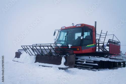 snow-compacting machinery in the fog mountains