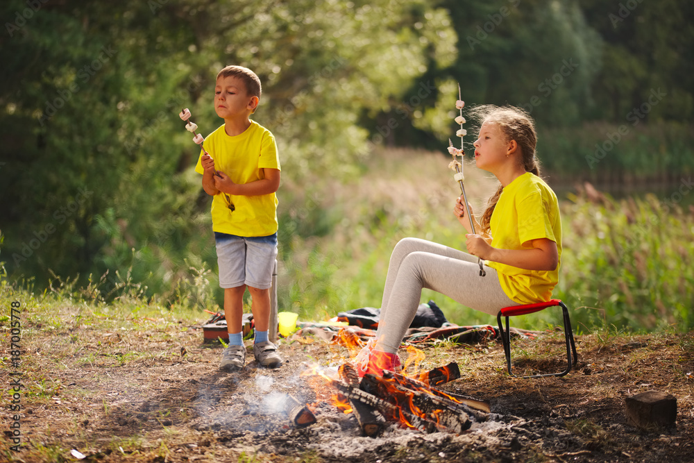 happy children hiking in the forest