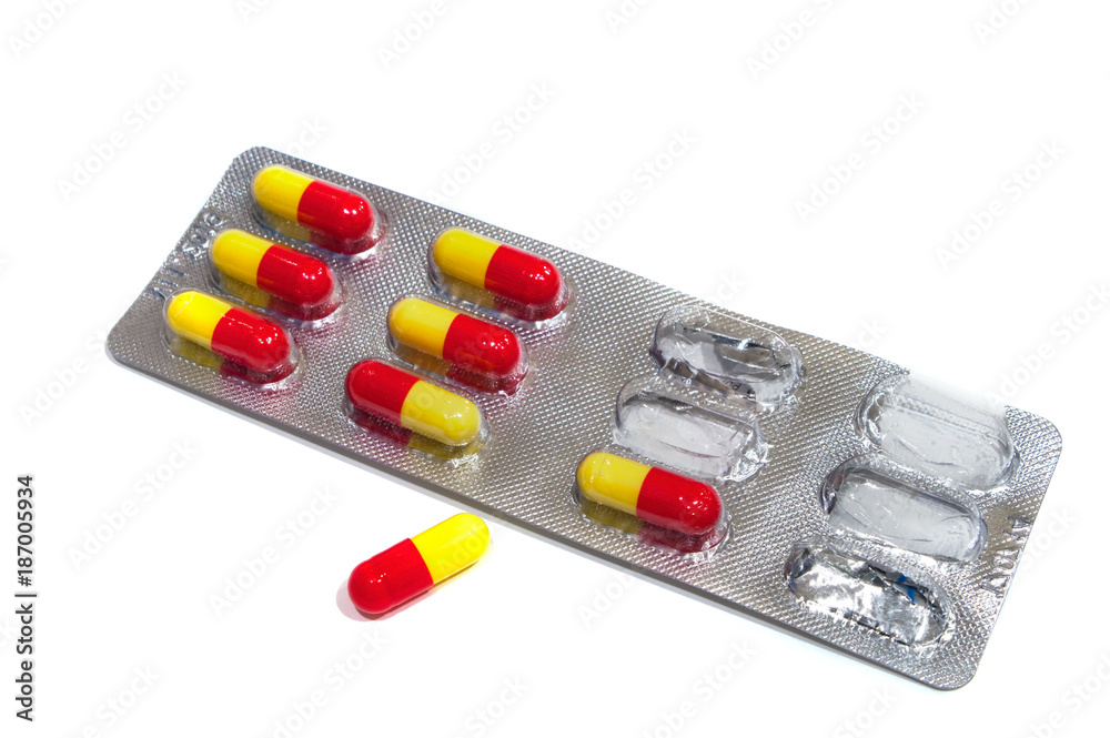 Red-yellow capsules isolated on white. Red-yellow capsules isolated on white.