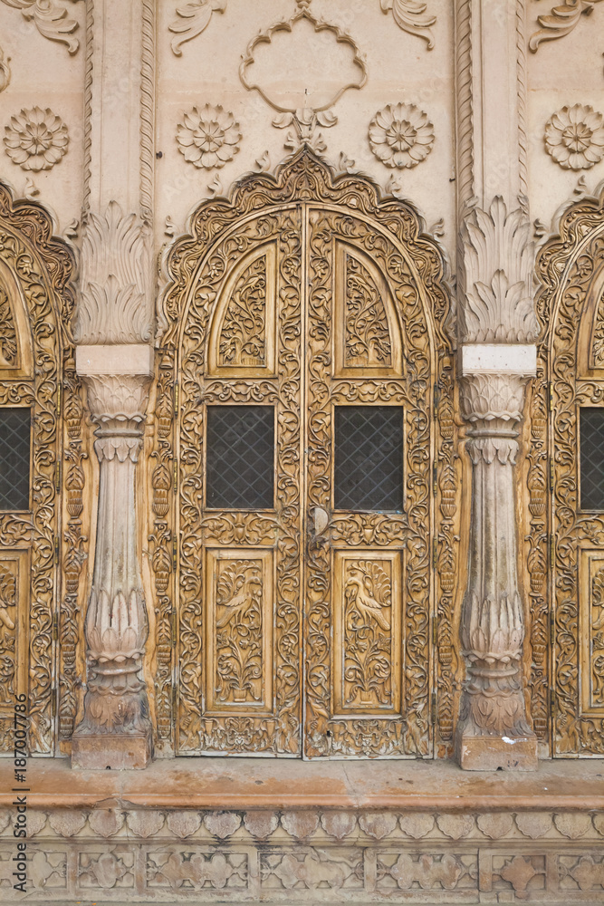 carved Islamic ornament wooden temple door in Vrndavana, India