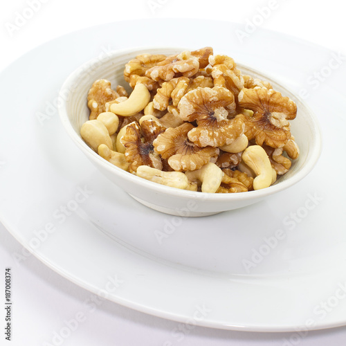 Assorted mixed nuts in white bowl