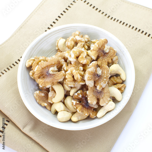 Assorted mixed nuts in white bowl
