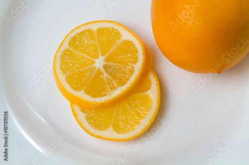 Oranges . Healthy fresh tasty food . Yellow Lemons . Slices of delicious juicy lemon   closeup .