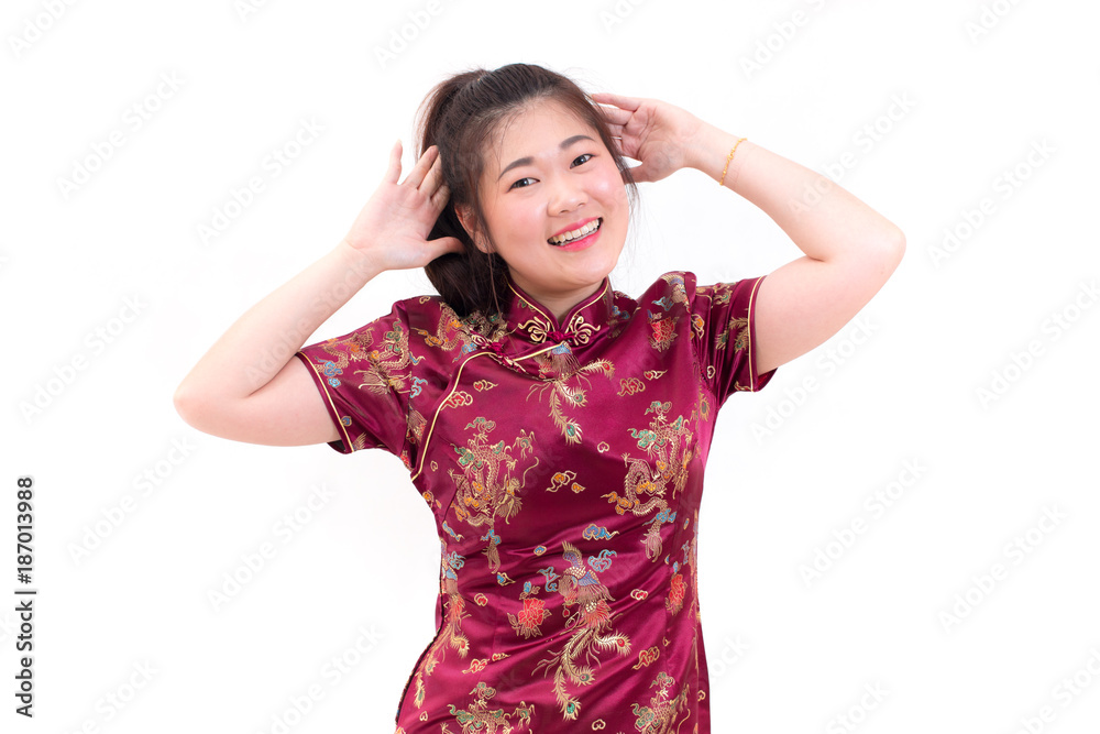 Young asian woman wearing chinese dress traditional cheongsam with gesture of congratulation, Looking at the camera and smile in Chinese New Year Festivities, New Year Celebration on white background.