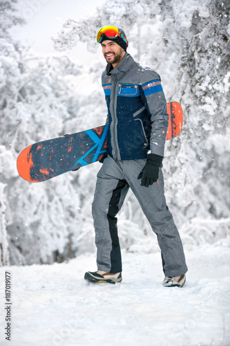 Man with snowboard in mountain