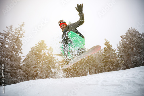 Male snowboarder in action