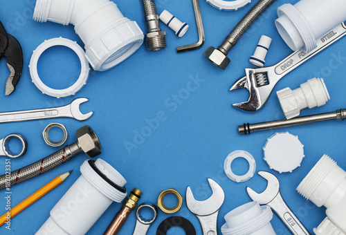 Plumbing tools and equipment overhead view on a blue background Fototapeta