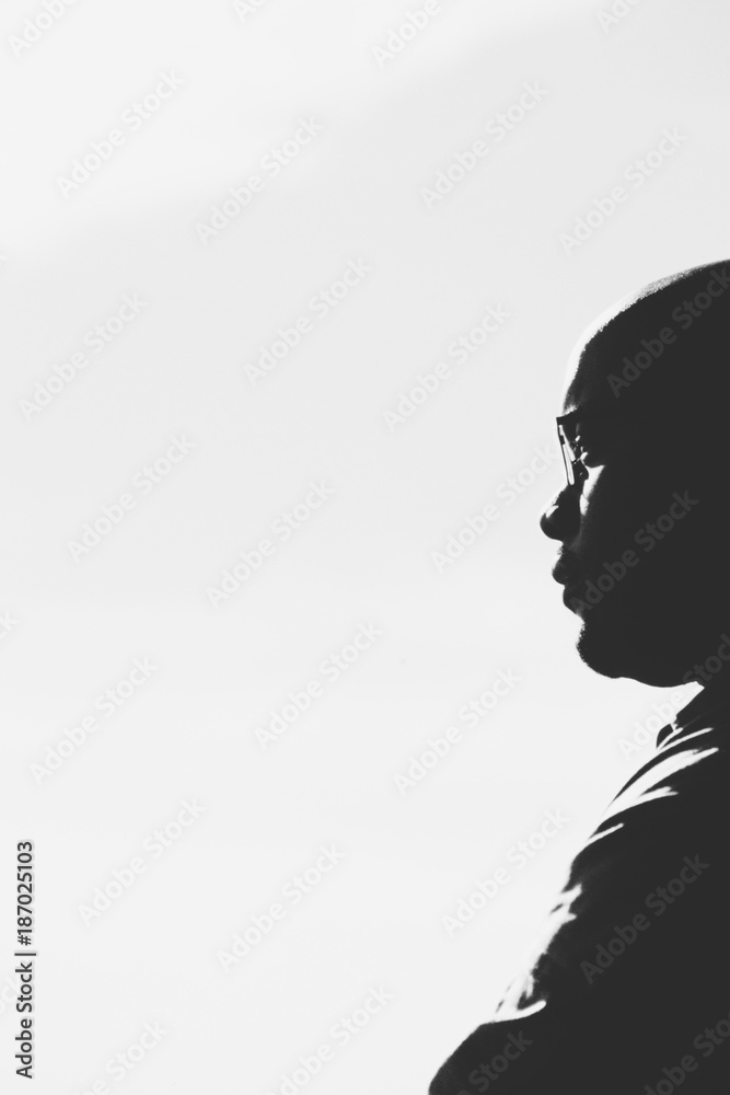 Profile of of young African American man, lost in thought Profile of of young African American man, lost in thought