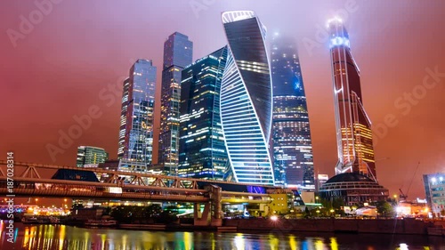 Zoom out Timelapse hyperlapse of Moscow city international business district at night photo