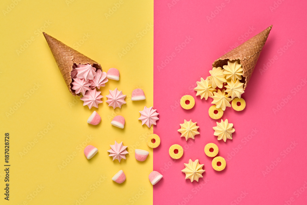Marshmallow, Meringue background. Ice Cream Cone with Gummy Candies Sweets. Flat lay. Summer Party, Birthday Firework. Bright Color. Trendy fashion Style. Minimal. Art