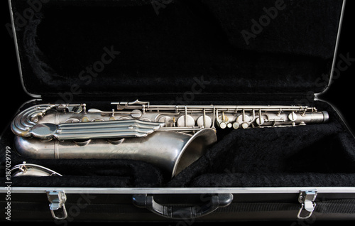 Silver saxophone in its case