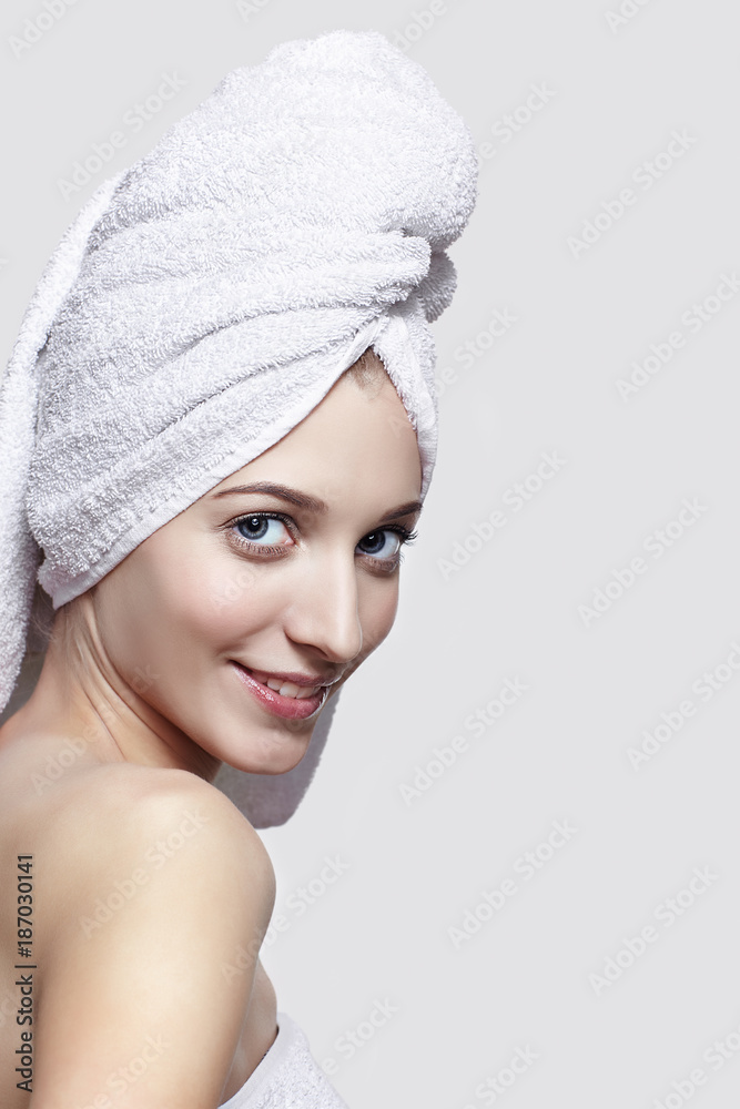 Obraz premium Young woman with bath towel on the head