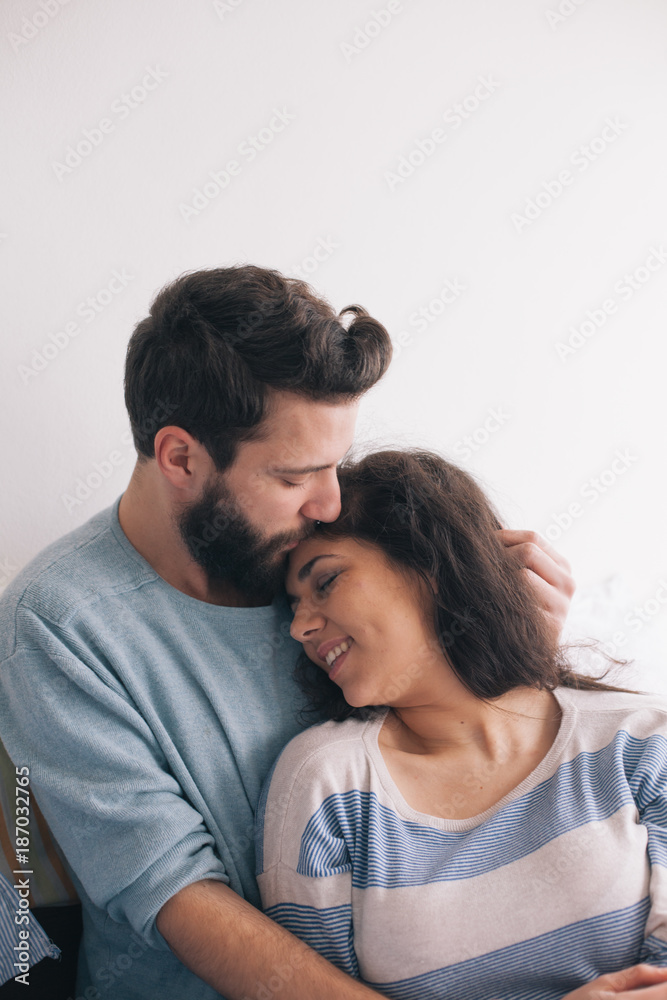 Couple spending time together in a bed Couple spending time together in a bed