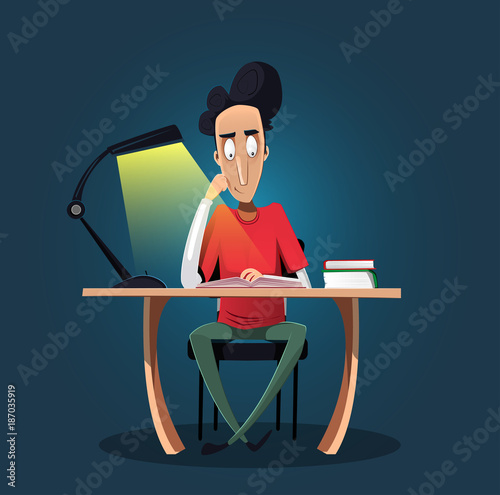 Fun confident young boy studying late at night