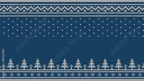 Knitted sweater ornament - spruce, falling snow, national patterns. White on a blue background.