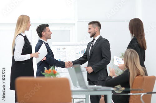 handshake business partners before a business presentation.