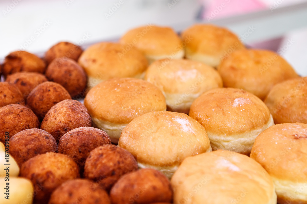 Assorted donuts with sugar Assorted donuts with sugar