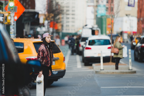 Female skater in the city street photo