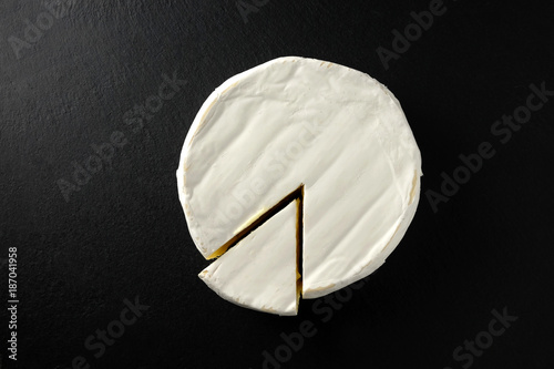 Tableau sur toile French cheese brie on slate plate.