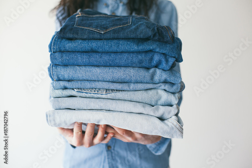 Woman holding jeans photo