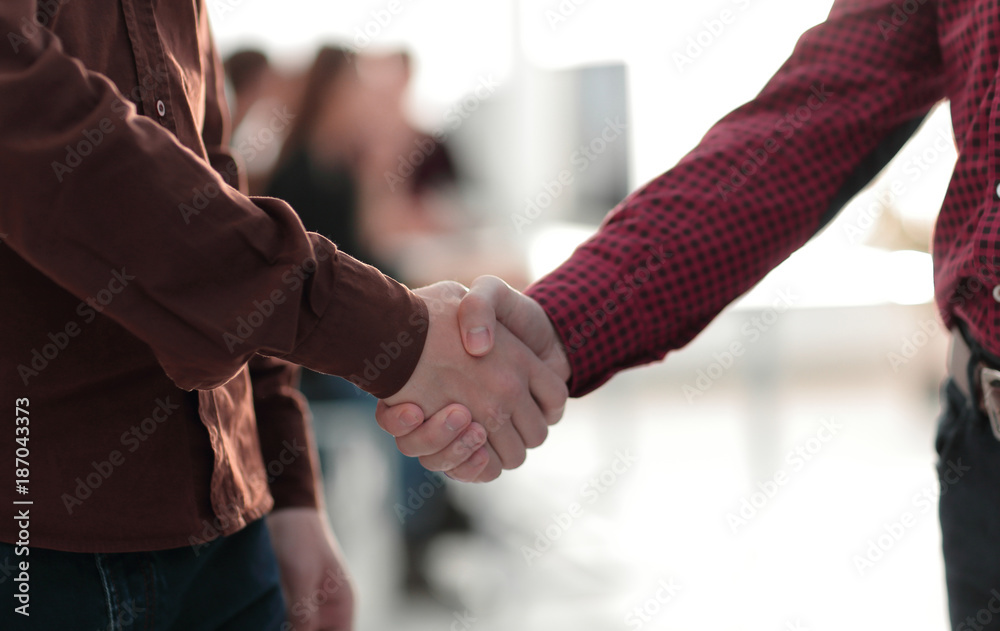 closeup of handshake between two men i