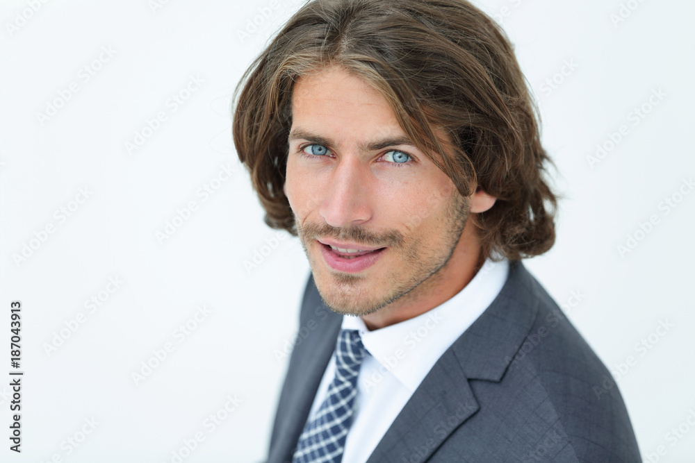 Close up portrait of an attractive young businessman smiling Close up portrait of an attractive young businessman smiling