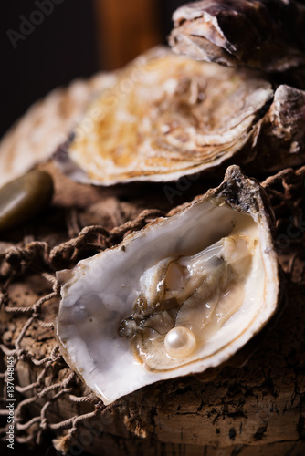 Opened oyster with a pearl inside.