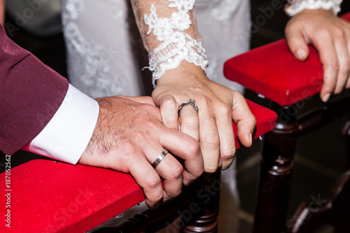 close-up hands of bride and groom  showing the wedding rings