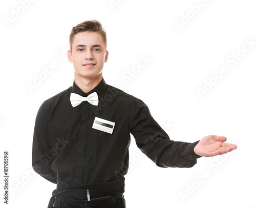 Handsome young waiter on white background