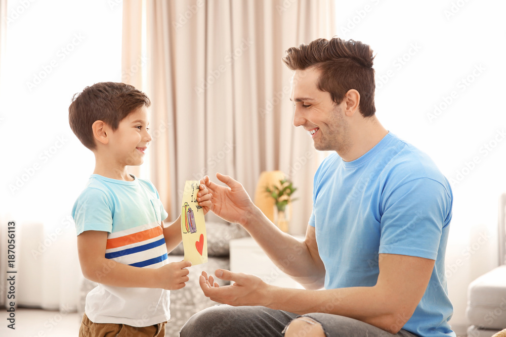 Little boy greeting his dad with Father's Day