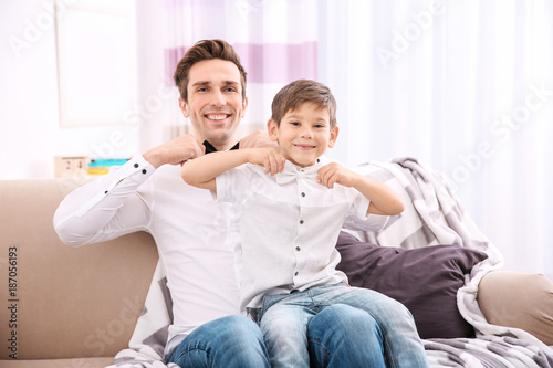 Father and son in shirts wi...