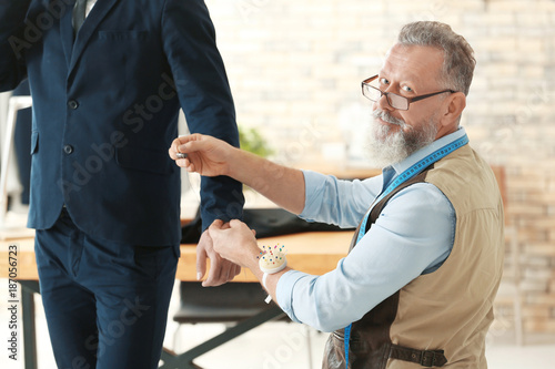Senior man tailoring formal...