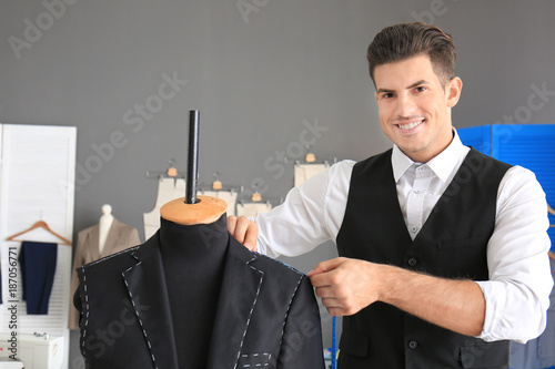 Tailor taking measurements ...