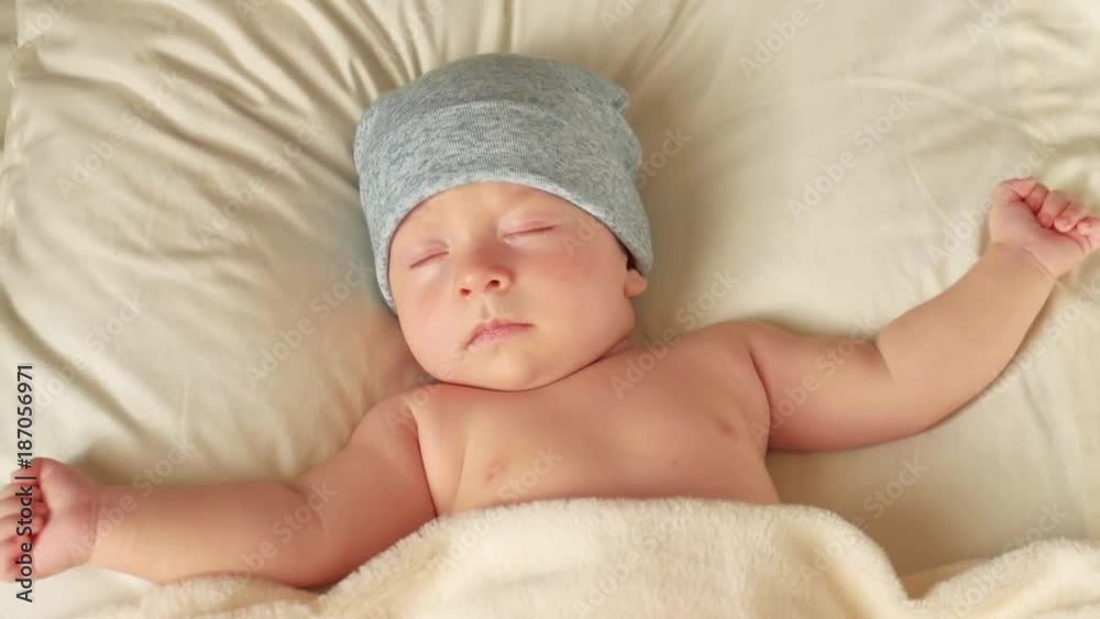Newborn baby boy in a blue knitted hat. Newborn baby boy in a blue knitted hat.