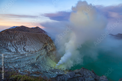 Sunrise at Kawah Ijen volcano crater with sulfur fume. Ijen crater the famous tourist attraction near Banyuwangi, East Java, Indonesia