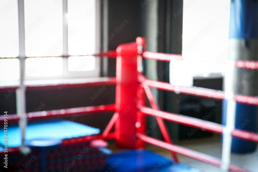 Blurred view of empty boxing ring in gym