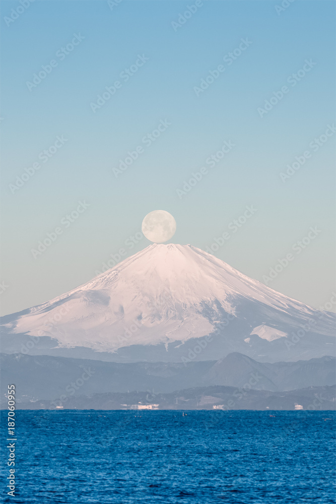 Pearl Fuji , the setting moon meeting the summit of Mt. Fuji. Seen from Yokosuka coast , Kanagawa prefecture. Pearl Fuji , the setting moon meeting the summit of Mt. Fuji. Seen from Yokosuka coast , Kanagawa prefecture.