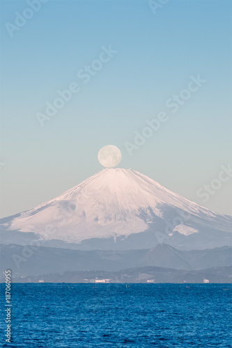 Pearl Fuji , the setting moon meeting the summit of Mt. Fuji. Seen from Yokosuka coast , Kanagawa prefecture.