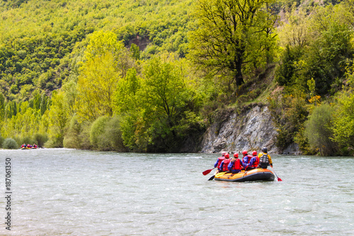 Rafting in a river of Huesca, Spain. Rafting at Tara mountain river. Group of tourists in the inflatable raft