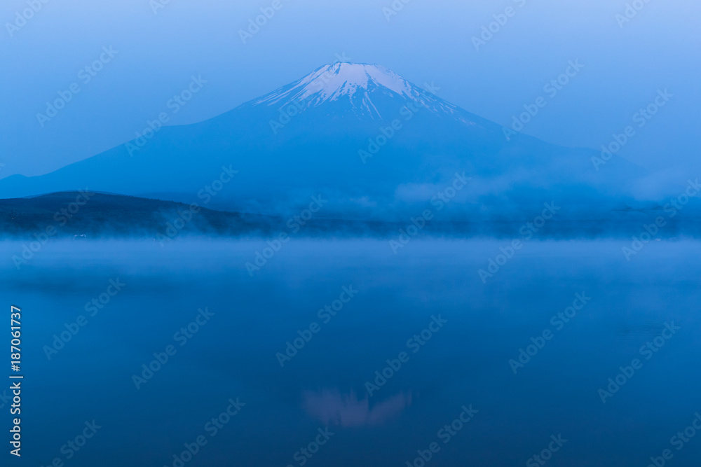 Mountain Fuji with morning mist in spring season at Lake Yamanakako