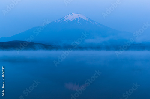 Mountain Fuji with morning mist in spring season at Lake Yamanakako