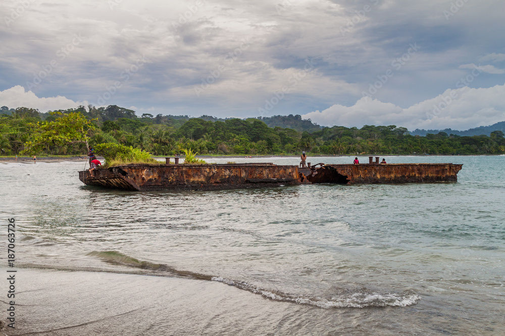 PUERTO VIEJO DE TALAMANCA, COSTA RICA  - MAY 16: People on a rusty pontoon in Puerto Viejo de Talamanca village, Costa Rica