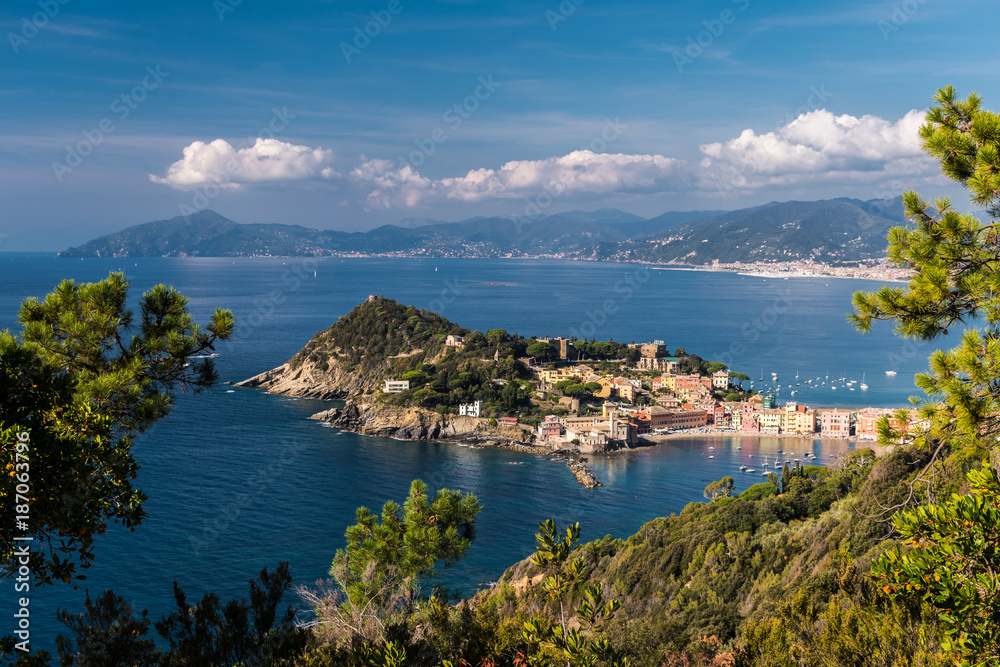 Panoramic view of Sestri Levante and its promontory; coastline of Liguria in the background