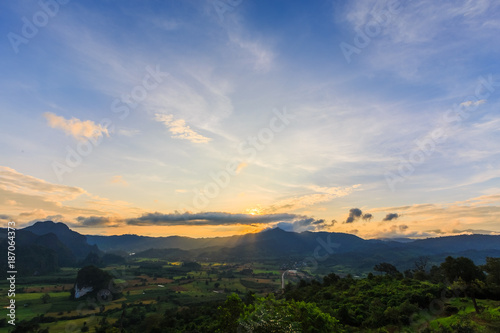 Beautiful of natural landscape. Mountains and blue skies with clouds and sunrise in morning. © chayantorn