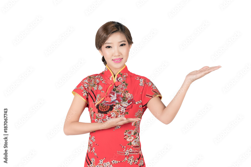 Pretty Asian female with Chinese traditional dress cheongsam or qipao hand showing blank space. Chinese new year concept, female model isolated on white background with clipping path.. Pretty Asian female with Chinese traditional dress cheongsam or qipao hand showing blank space. Chinese new year concept, female model isolated on white background with clipping path..