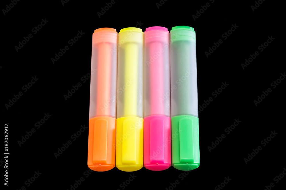 Multicolored highlighters isolated on black background, Highlighter to highlight text, study tools Multicolored highlighters isolated on black background, Highlighter to highlight text, study tools