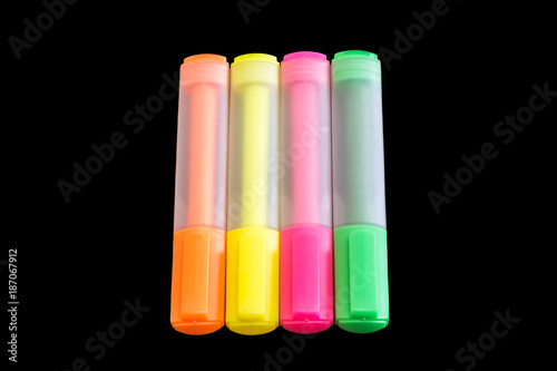 Multicolored highlighters isolated on black background, Highlighter to highlight text, study tools