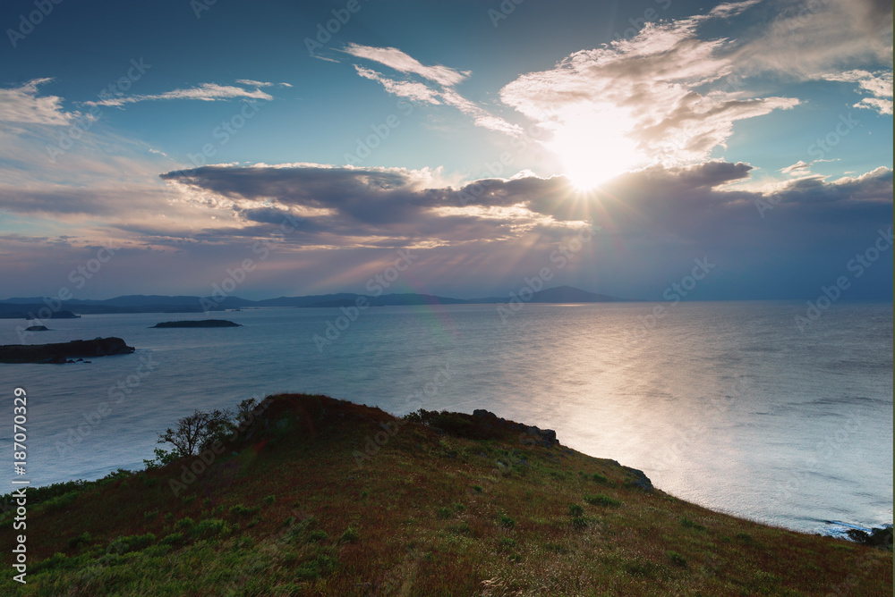 Sunrise on the peninsula on behalf of Krabbe in Japanese sea. Sunrise on the peninsula on behalf of Krabbe in Japanese sea.